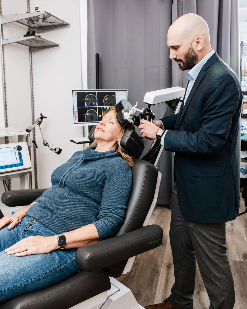 Valerie Zeko (left) and Dr. Ian Kratter in the treatment room at the Brain Stimulation Lab.