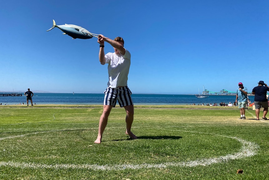 A participant in the Tunarama tuna toss.