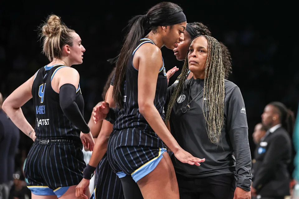 Chicago Sky forward Angel Reese talks with former head coach Teresa Weatherspoon.Wendell Cruz-Imagn Images