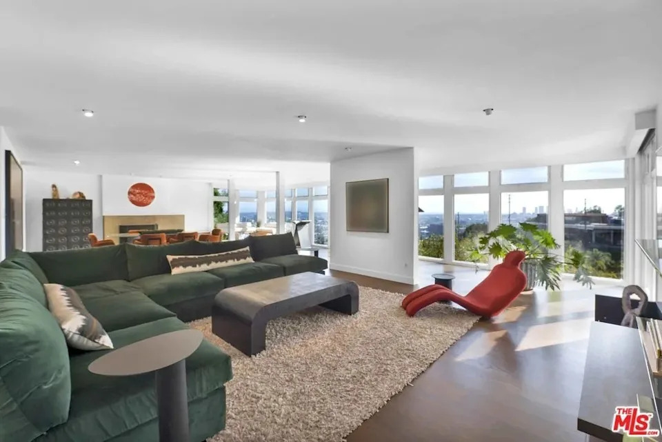 The 2,211 square foot home, originally built in 1962, features a wide open floor pla, with rich hardwood flooring.