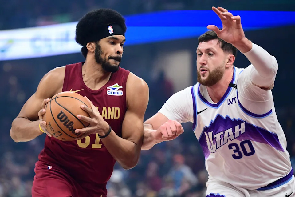 Jan 12, 2026; Cleveland, Ohio, USA; Cleveland Cavaliers center Jarrett Allen (31) drives to the basket against Utah Jazz center Jusuf Nurkic (30) during the first quarter at Rocket Arena. Mandatory Credit: Ken Blaze-Imagn Images