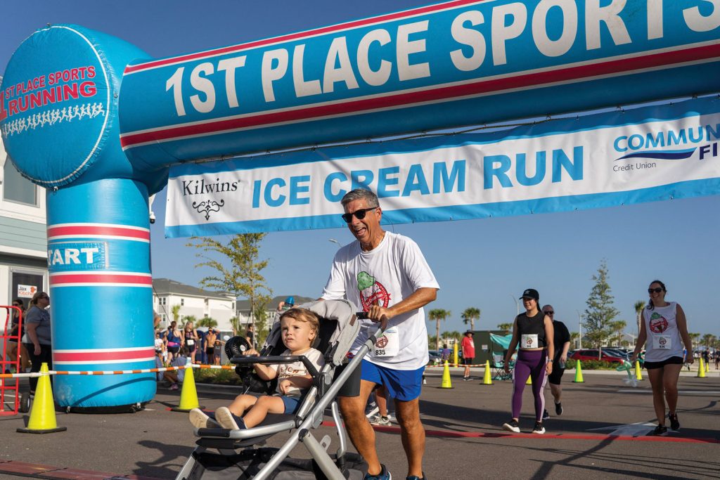 Sam Inman with nephew Hudson at Kilwins 5k presented by Community First