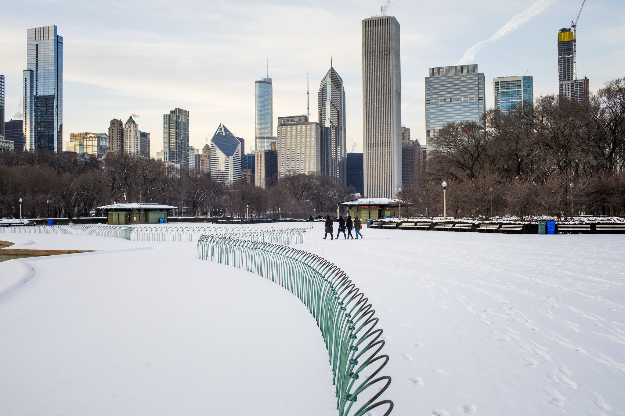 Pedestrians walk through the snow near Buckingham Fountain in Chicago...