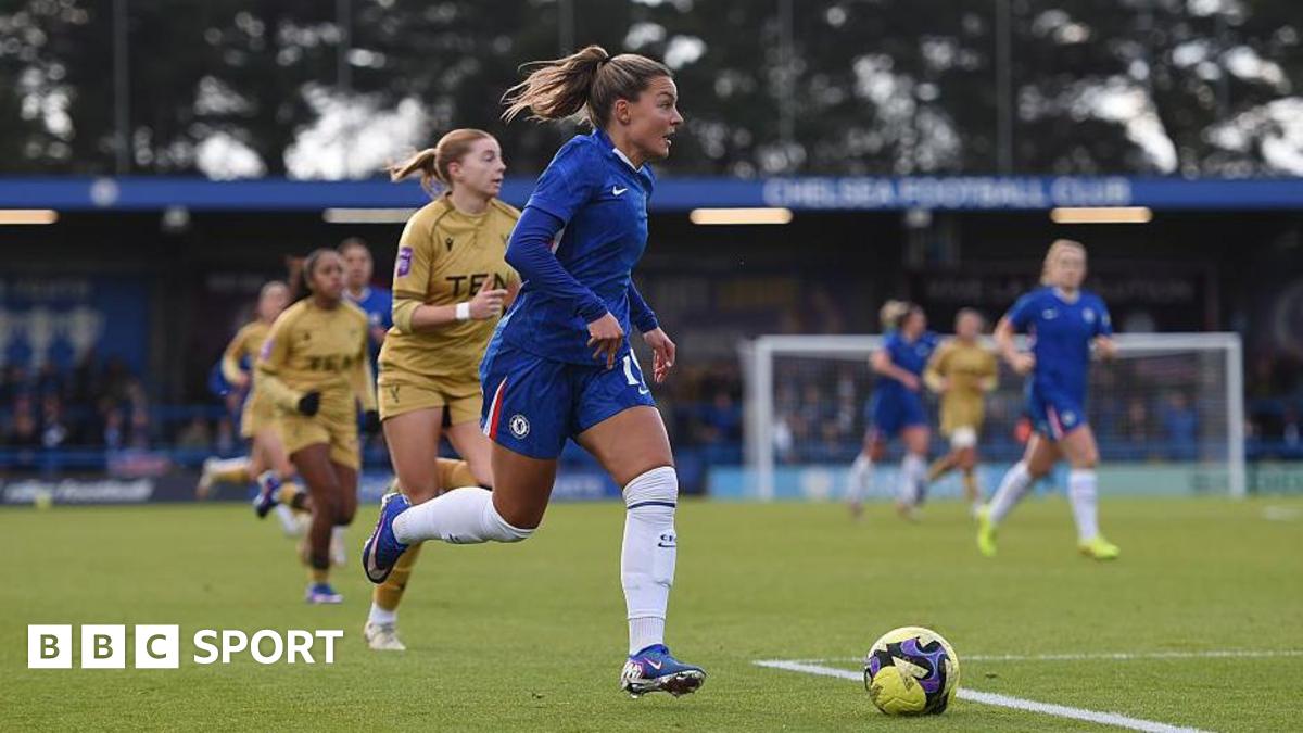 Johanna Rytting Kaneryd, of Chelsea, in action during the Women's FA Cup fourth round match against Crystal Palace. She has blonde hair, tied back, and is looking in front of her as she runs with the ball. Several other players can be seen in the background.