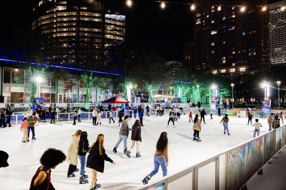 people ice skating on a rink