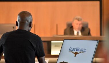 man speaking at city council