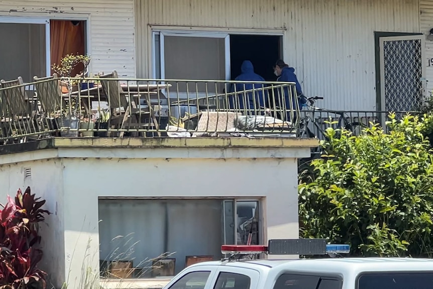 Forensics crews enter a property in Port Macquarie.