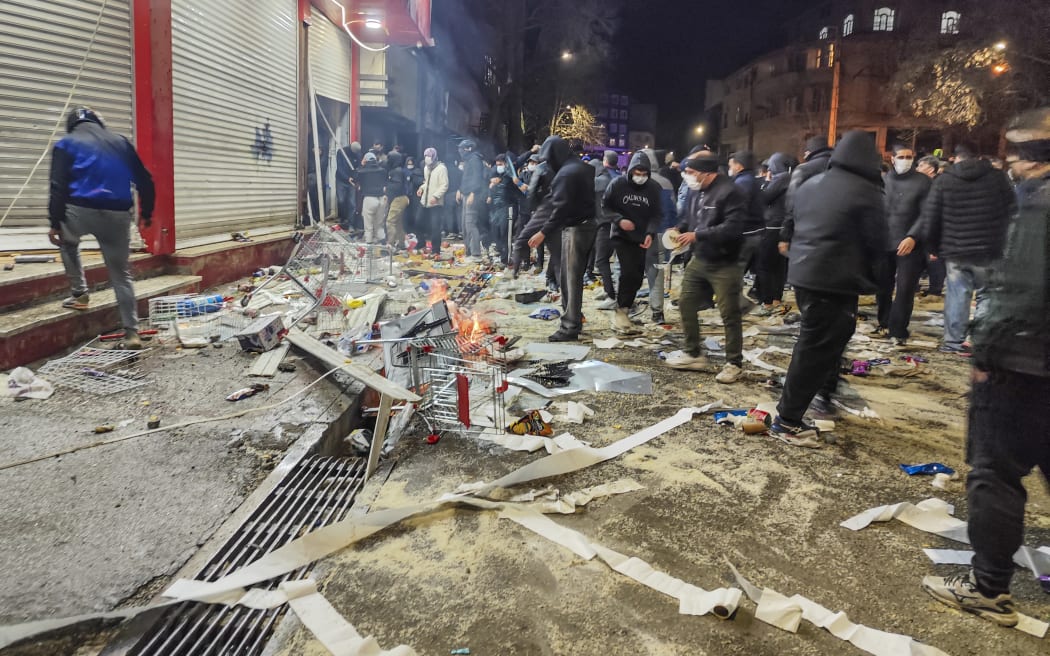 Iranians gather while blocking a street during a protest in Kermanshah, Iran on January 8, 2026.