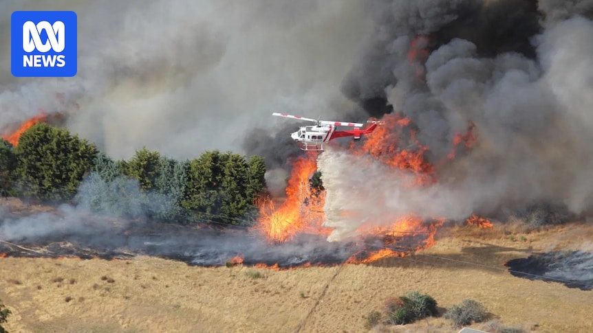 Victorian properties feared lost in out-of-control bushfire as heatwave persists