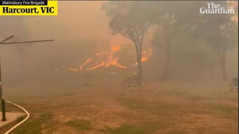 Firefighters battle bushfire in regional Victoria, where 50 structures were destroyed – video