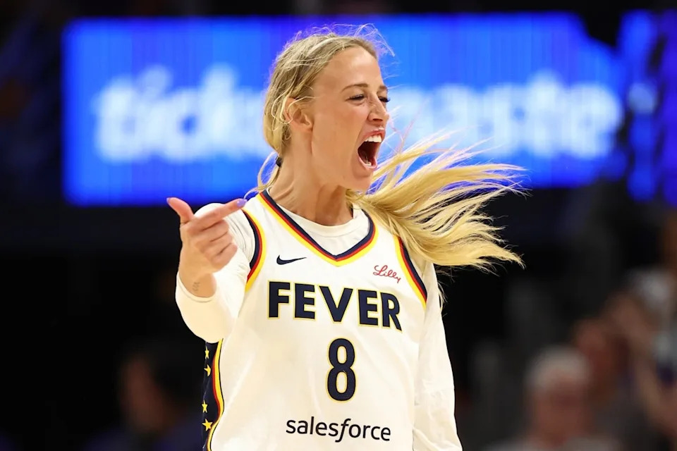 Indiana Fever guard Sophie Cunningham (8) celebrates a three point shot during a game.Mark J&period; Rebilas-Imagn Images