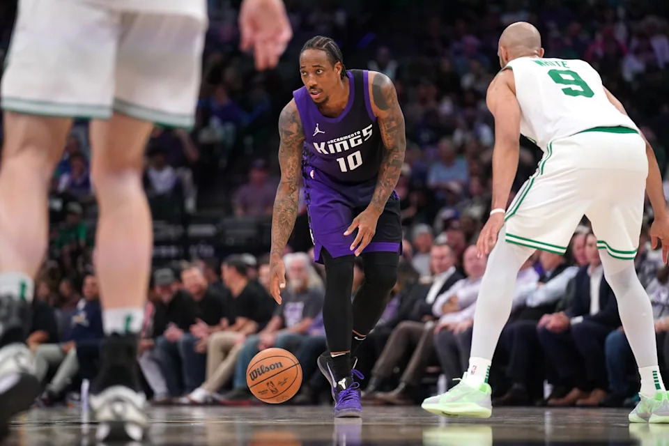 Mar 24, 2025; Sacramento, California, USA; Sacramento Kings guard DeMar DeRozan (10) dribbles the ball next to Boston Celtics guard Derrick White (9) in the fourth quarter at the Golden 1 Center. Mandatory Credit: Cary Edmondson-Imagn Images