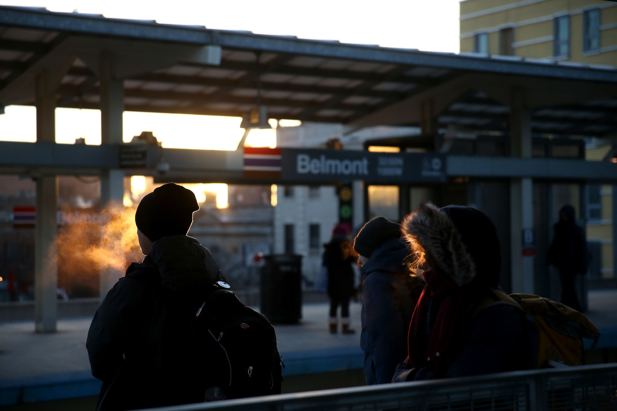 Commuters wait in below zero temperatures for a CTA Red...