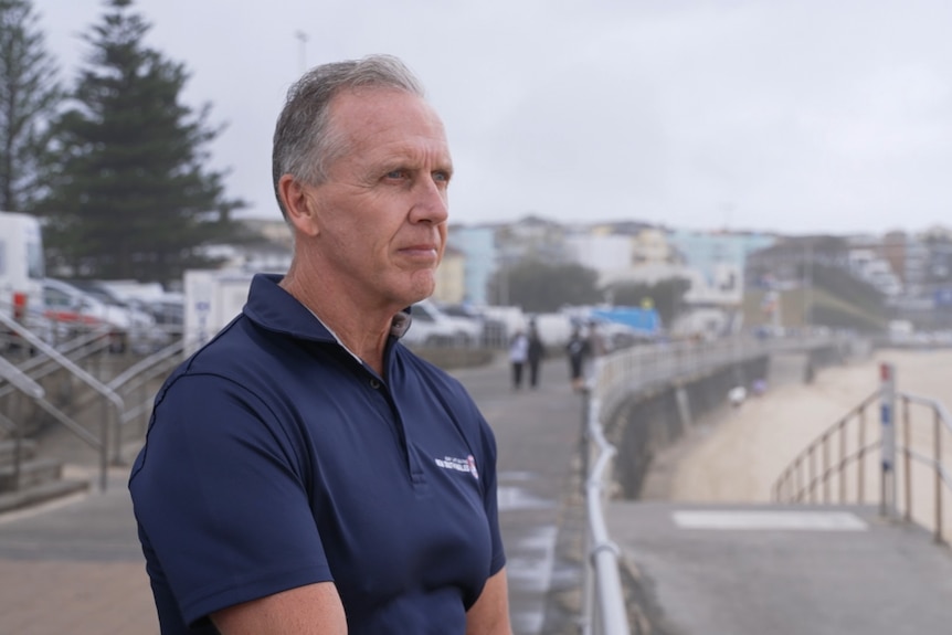 Steve Pearce has a serious expression as he looks out on Bondi Beach.