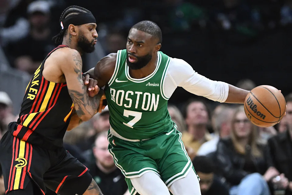 Jan 28, 2026; Boston, Massachusetts, USA; Boston Celtics guard Jaylen Brown (7) drives to the basket against Atlanta Hawks guard Nickeil Alexander-Walker (7) during the first half at the TD Garden. Mandatory Credit: Brian Fluharty-Imagn Images
