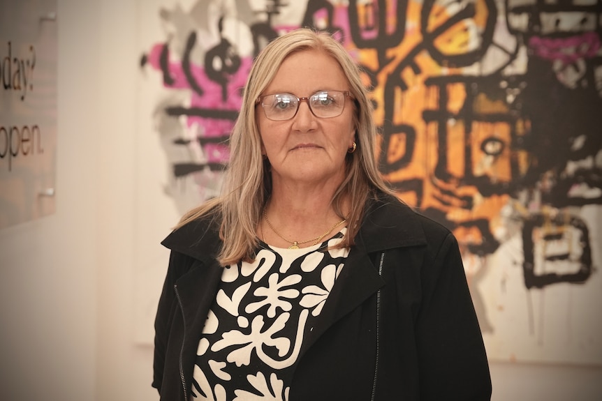 A mental health worker with a serious expression.