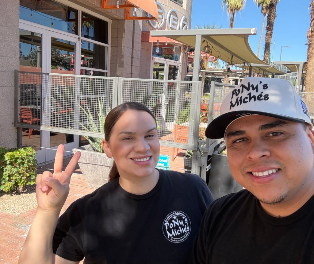 PoNy's Miches owners in front of downtown building.