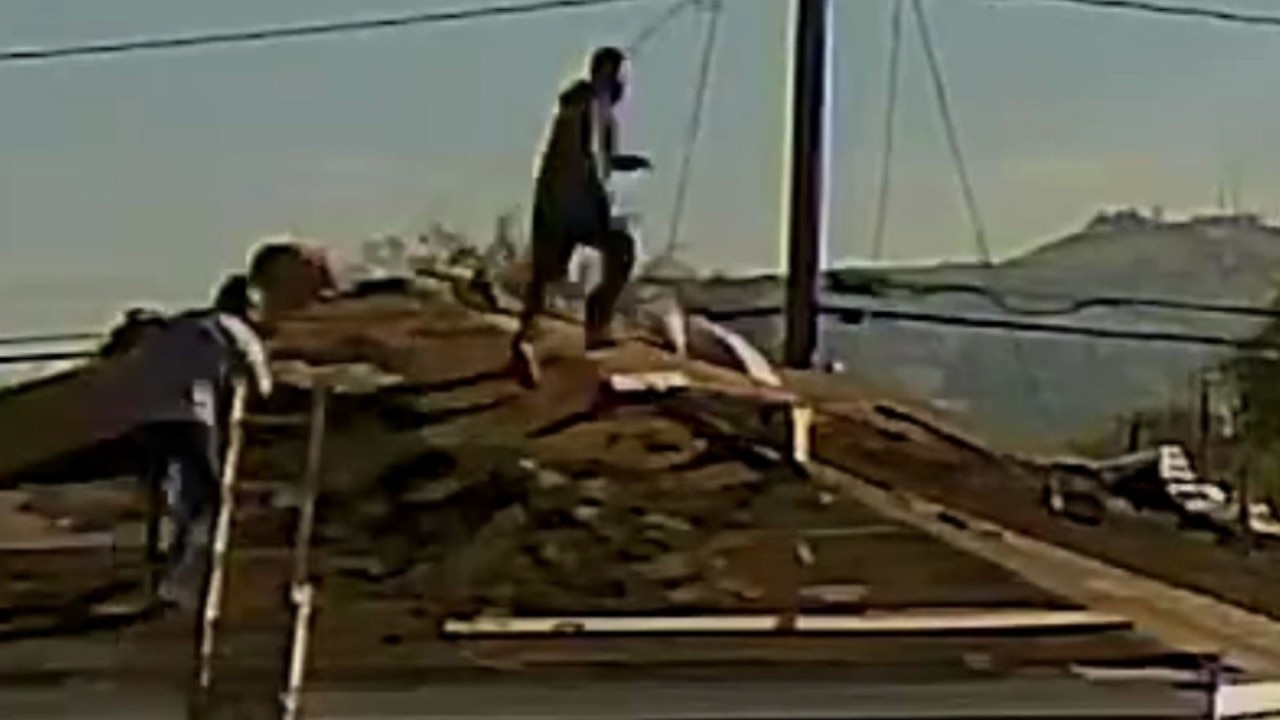 Construction workers hop across roofs mid-ICE raid