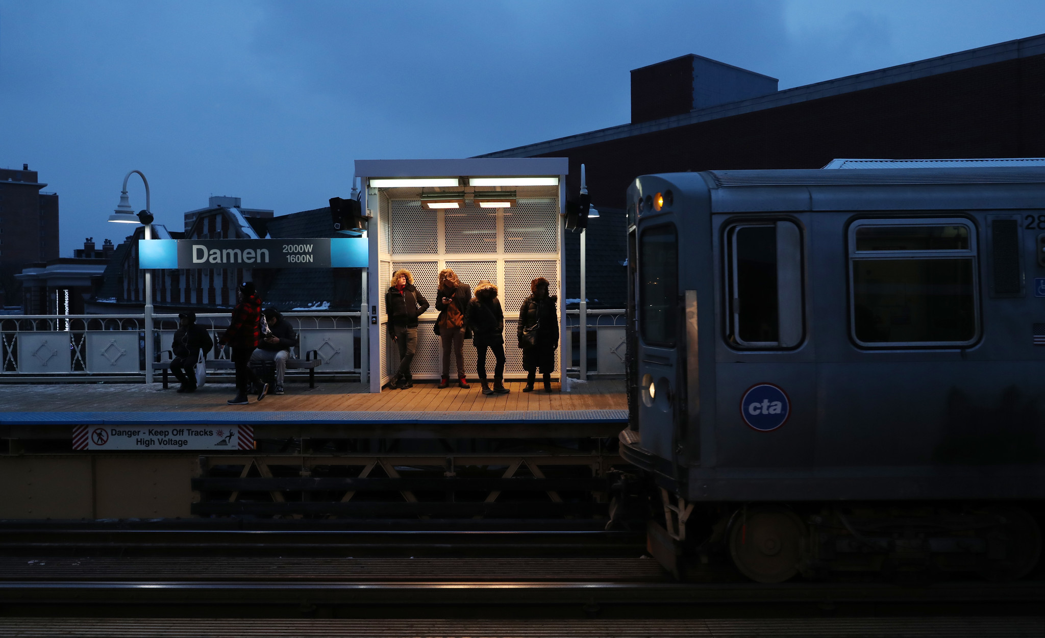 CTA passengers stand in a heat shelterÂ at the Blue Line...