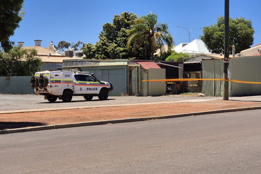 A police vehicle parked outside an office on Boulder Road.