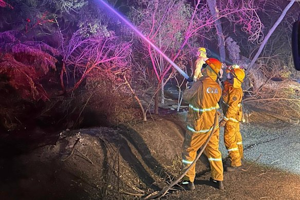 Firefighters battle the Longwood fire on Thursday night.