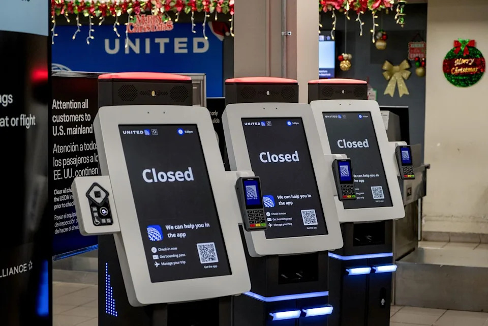 Yadira Hernandez-Pico/Bloomberg via Gett Closed signs on United Airlines self-service kiosks at Rafael Hernandez International Airport in Aguadilla, Puerto Rico, on Jan. 3, 2026.