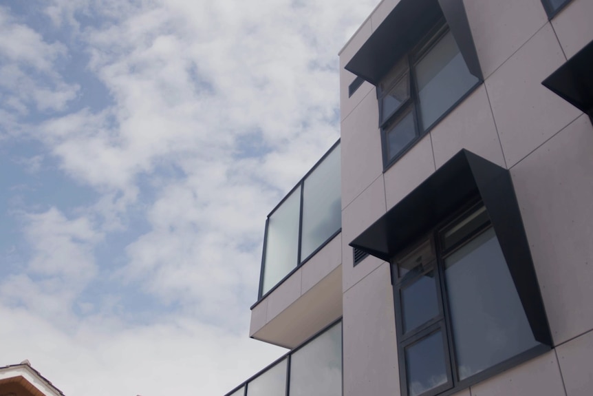 The exterior of a multistorey apartment building.