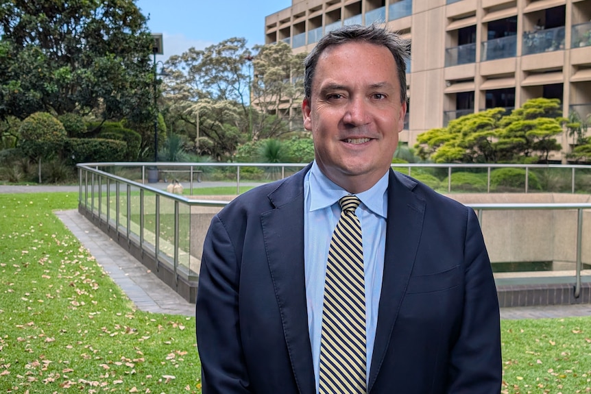 John Ruddick a NSW politician stands outdoors looking at the camera.