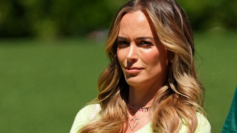 Koepka’s SI Swim model wife swings in mini-dress to address his play