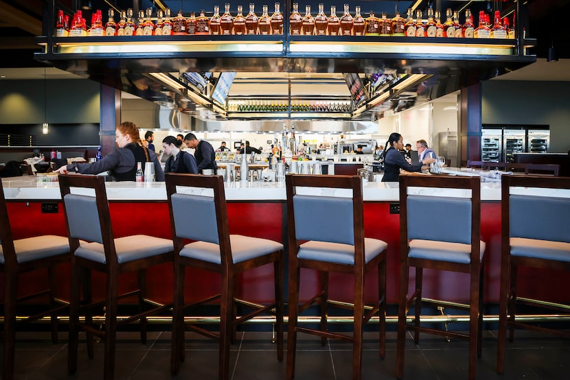 Diners to J. Alexander's in Plano walk in and immediately see a very large, U-shaped bar.