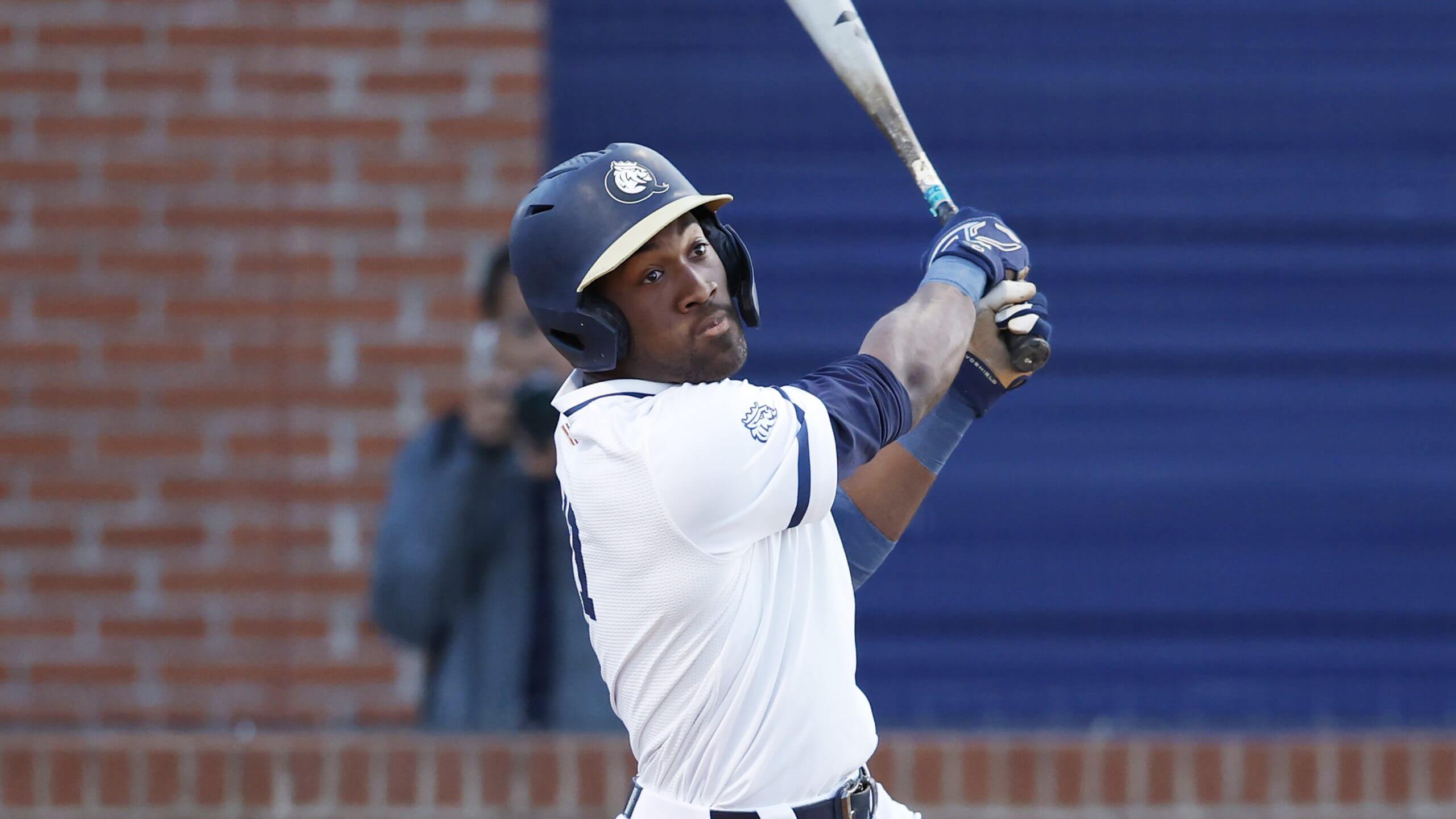 Queens batter Dillon Lewis hits against Florida Gulf Coast during an NCAA baseball game on Thursday, March 28, 2024, in Charlotte, N.C. 