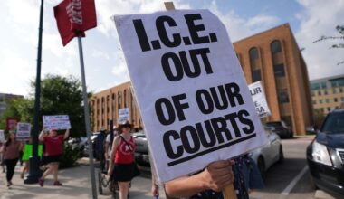 Immigration advocates protest recent detentions by ICE outside the immigration court in San Antonio, Texas, Tuesday, July 1, 2025. (AP Photo/Eric Gay)