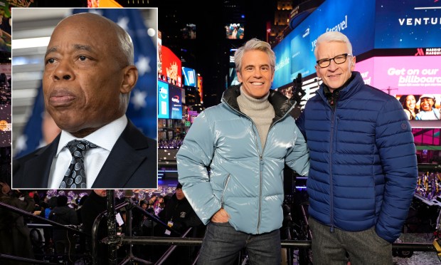Andy Cohen, left, and Anderson Cooper host CNN's "New Year's Eve Live" in Times Square Wednesday night, where Cohen lambasted outgoing Mayor Eric Adams (inset).