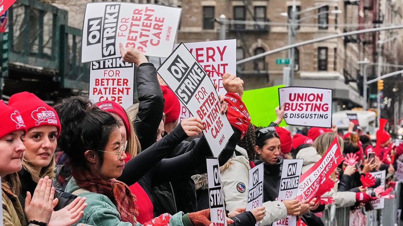 Striking nurses demonstrate outside Mt. Sinai Hospital, in New York, Wednesday, Jan. 14, 2026. (AP Photo/Richard Drew)