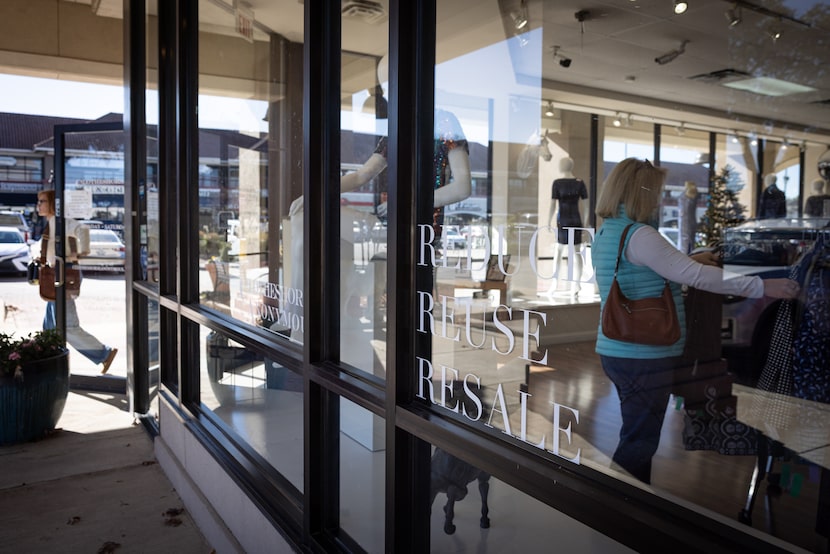 A customer departs Clotheshorse Anonymous while another continues to shop on Tuesday, Dec....
