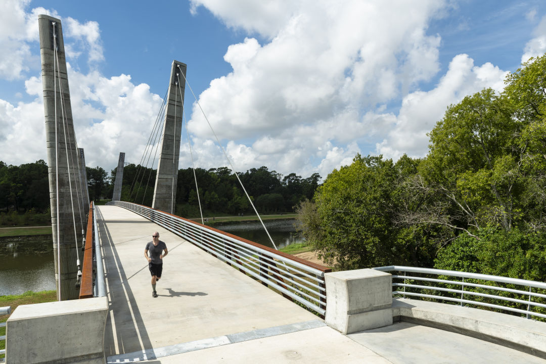 Man jogging on the Mason Bridge.