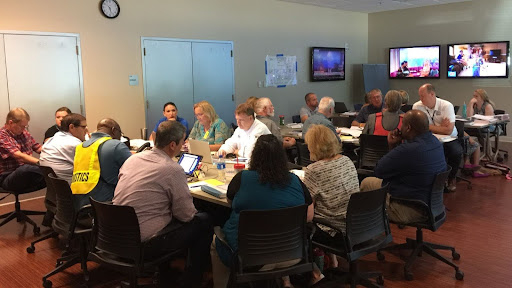 UNF's Incident Management Team sitting around two tables