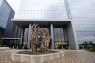 A sculpture in front of the entrance to the TIAA campus in Frisco, Texas, Monday, July 14,...