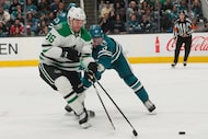 Dallas Stars right wing Mikko Rantanen, left, reaches for the puck against San Jose Sharks...