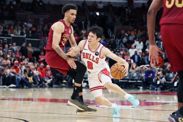 Cleveland Cavaliers guard Tyrese Proctor tries to stop Chicago Bulls guard Yuki Kawamura during a preseason game at the United Center on Oct. 9, 2025. (Terrence Antonio James/Chicago Tribune)