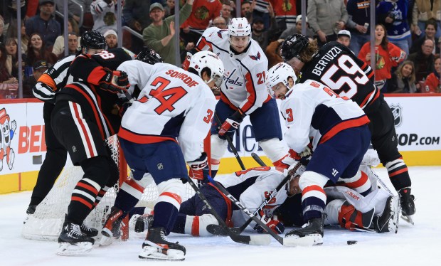 A scrum ensues at the Capitals goal in the first period against the Blackhawks at the United Center on Jan. 9, 2026, in Chicago. (John J. Kim/Chicago Tribune)
