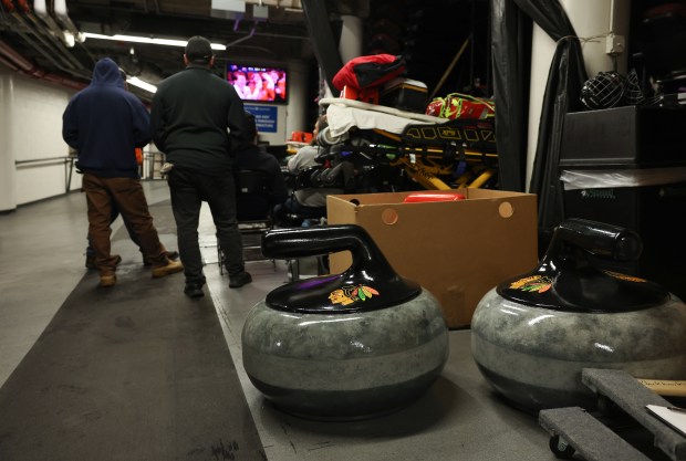 Oversized curling stones are placed outside the rink for use during game stoppages in the third period of a Blackhawks-Capitals game at the United Center on Jan. 9, 2026, in Chicago. (John J. Kim/Chicago Tribune)