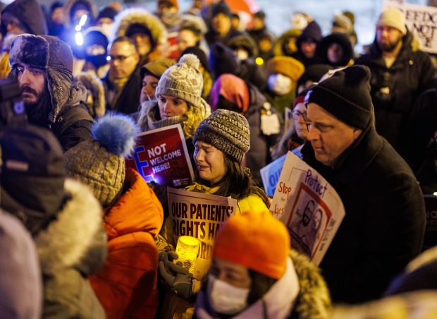 People attend a vigil for Alex Pretti outside the Jesse Brown VA Medical Center on Jan. 28, 2026, in Chicago. Federal immigration officers shot and killed Pretti, a 37-year-old intensive care unit nurse, in Minneapolis last week. (Armando L. Sanchez/Chicago Tribune)
