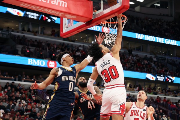 Bulls guard Tre Jones (30) goes up for a reverse layup in the first half against the Pelicans at the United Center on Wednesday, Dec. 31, 2025. (Terrence Antonio James/Chicago Tribune)