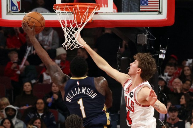 Pelicans forward Zion Williamson (1) puts up a shot as Bulls forward Matas Buzelis (14) defends in the first half at the United Center on Wednesday, Dec. 31, 2025. (Terrence Antonio James/Chicago Tribune)