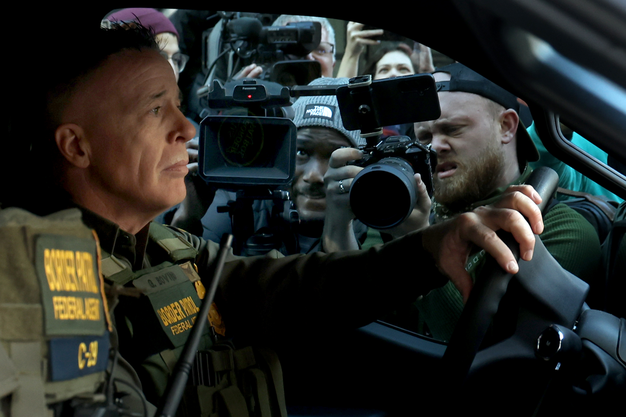 Border Patrol Cmdr. Gregory Bovino prepares to drive away in...