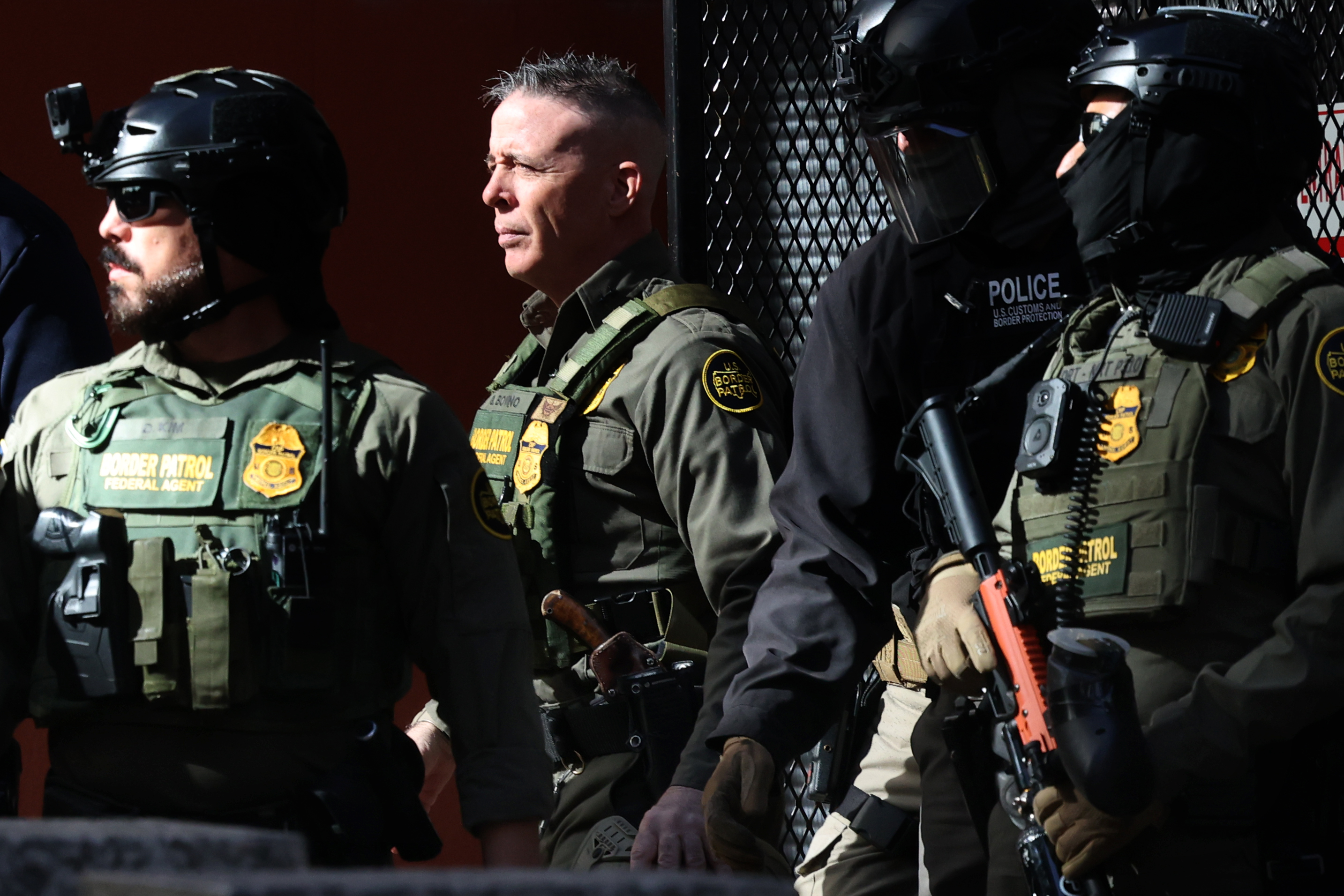 Border Patrol Cmdr. Gregory Bovino, center, exits the Dirksen U.S....