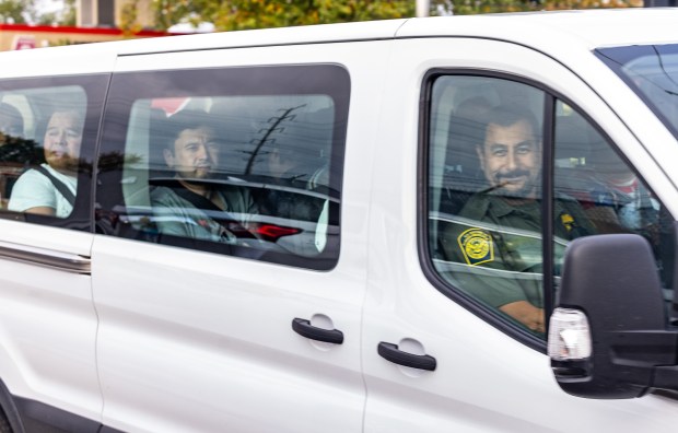 Federal agents drive detainees toward the Immigration and Customs Enforcement holding facility in Broadview, Oct. 18, 2025. (Dominic Di Palermo/Chicago Tribune)