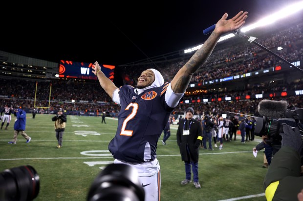 Chicago Bears wide receiver DJ Moore (2) celebrates after making the game-winning touchdown catch in overtime of a game against the Green Bay Packers at Soldier Field in Chicago on Dec. 20, 2025. (Chris Sweda/Chicago Tribune)