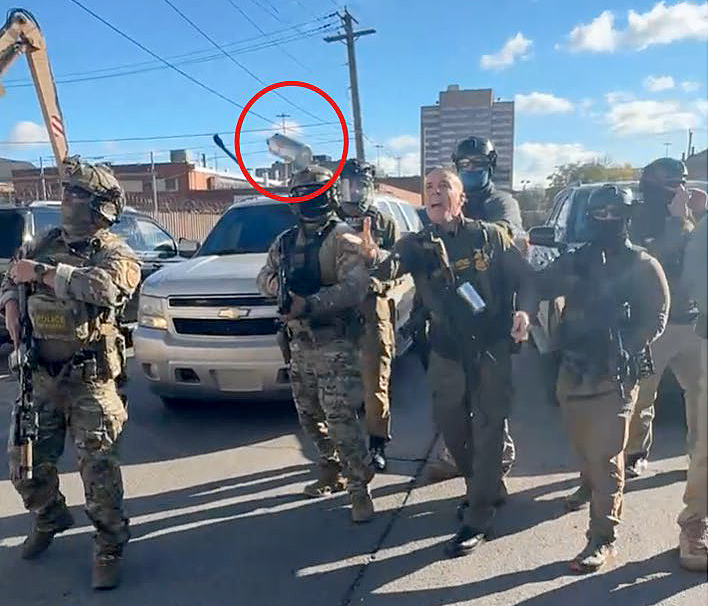 An annotated image from video in a court document appears...